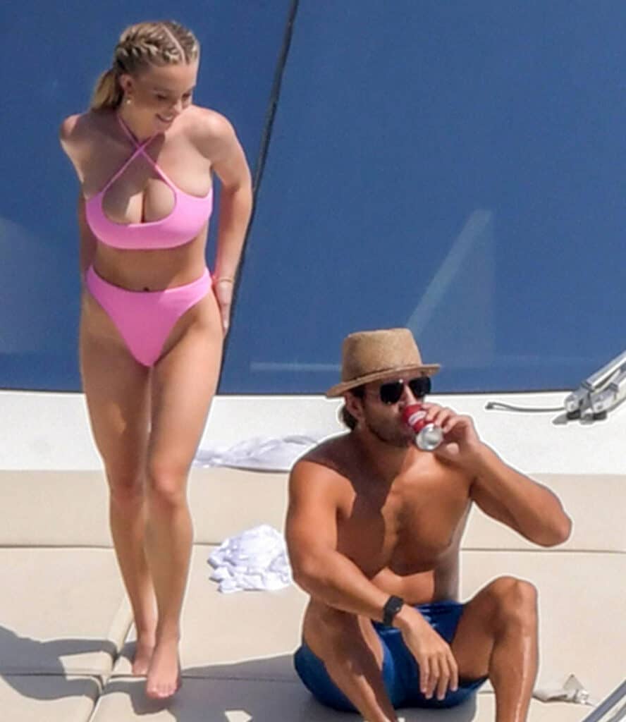 sydney sweeney flaunts her curves in a pink bikini as she packs on the pda with her boyfriend during a boat ride in capri italy 280721 2