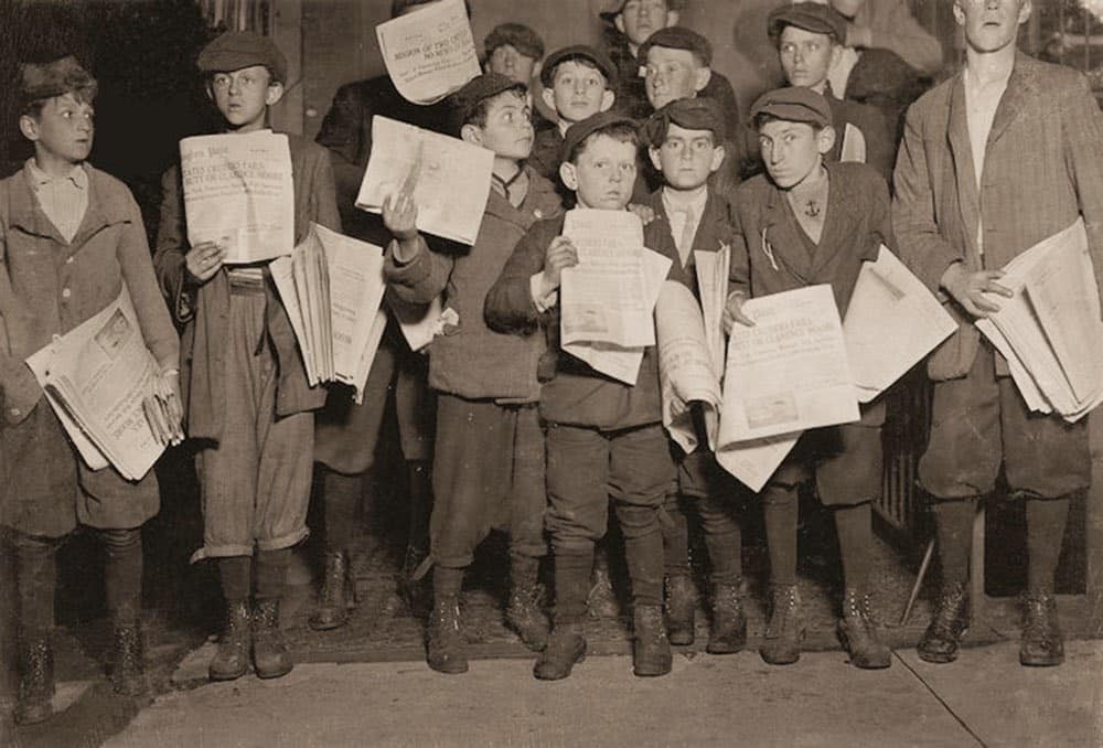 Out after midnight selling newspapers, many young boys worked late into the night. The youngest among them was just 9 years old. Harry, age 11, Eugene, and the others were only slightly older. This scene unfolded in Washington, D.C., highlighting the harsh realities of child labor at the time.
